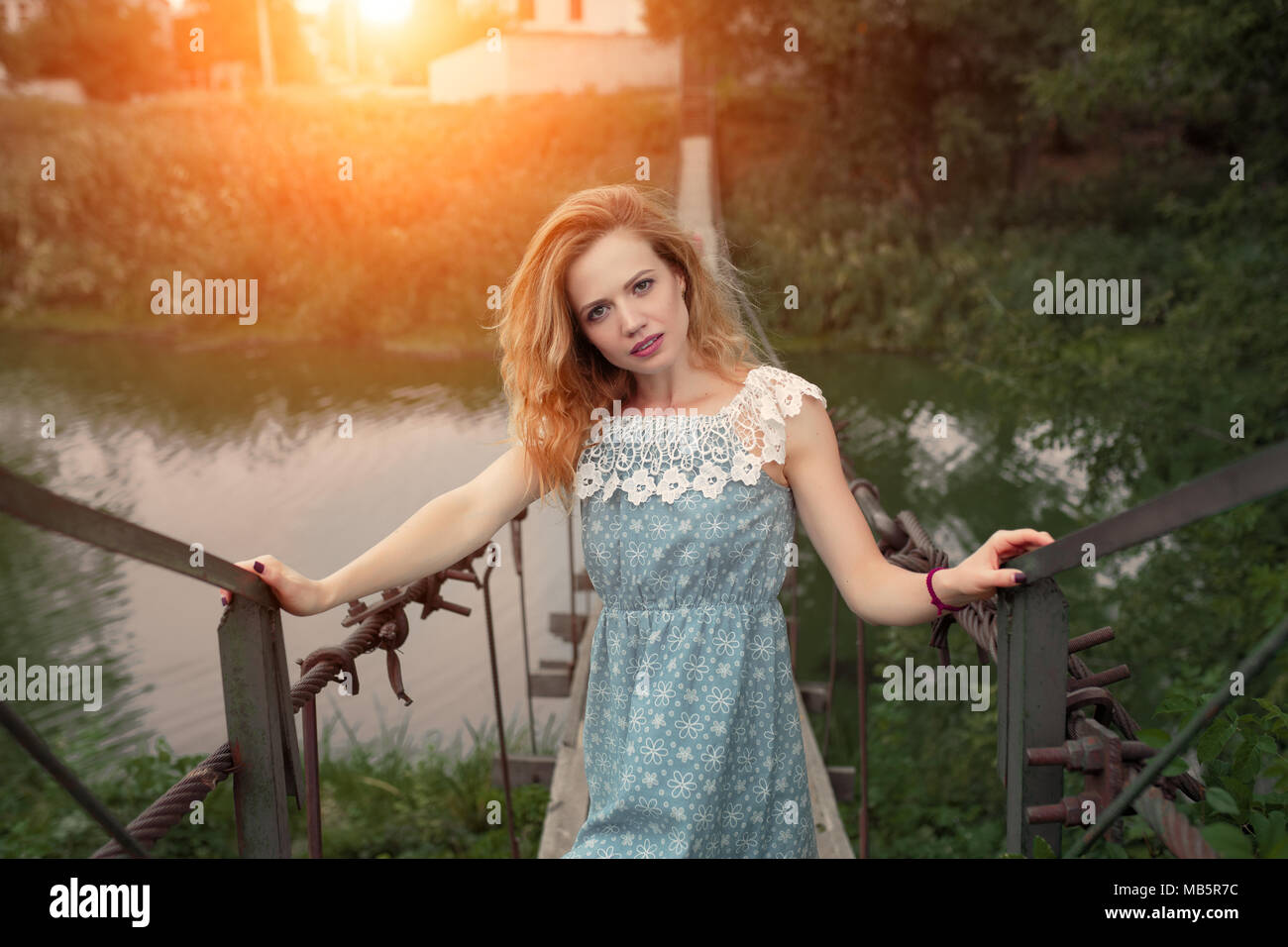 Girl standing on bridge over hi-res stock photography and images - Alamy