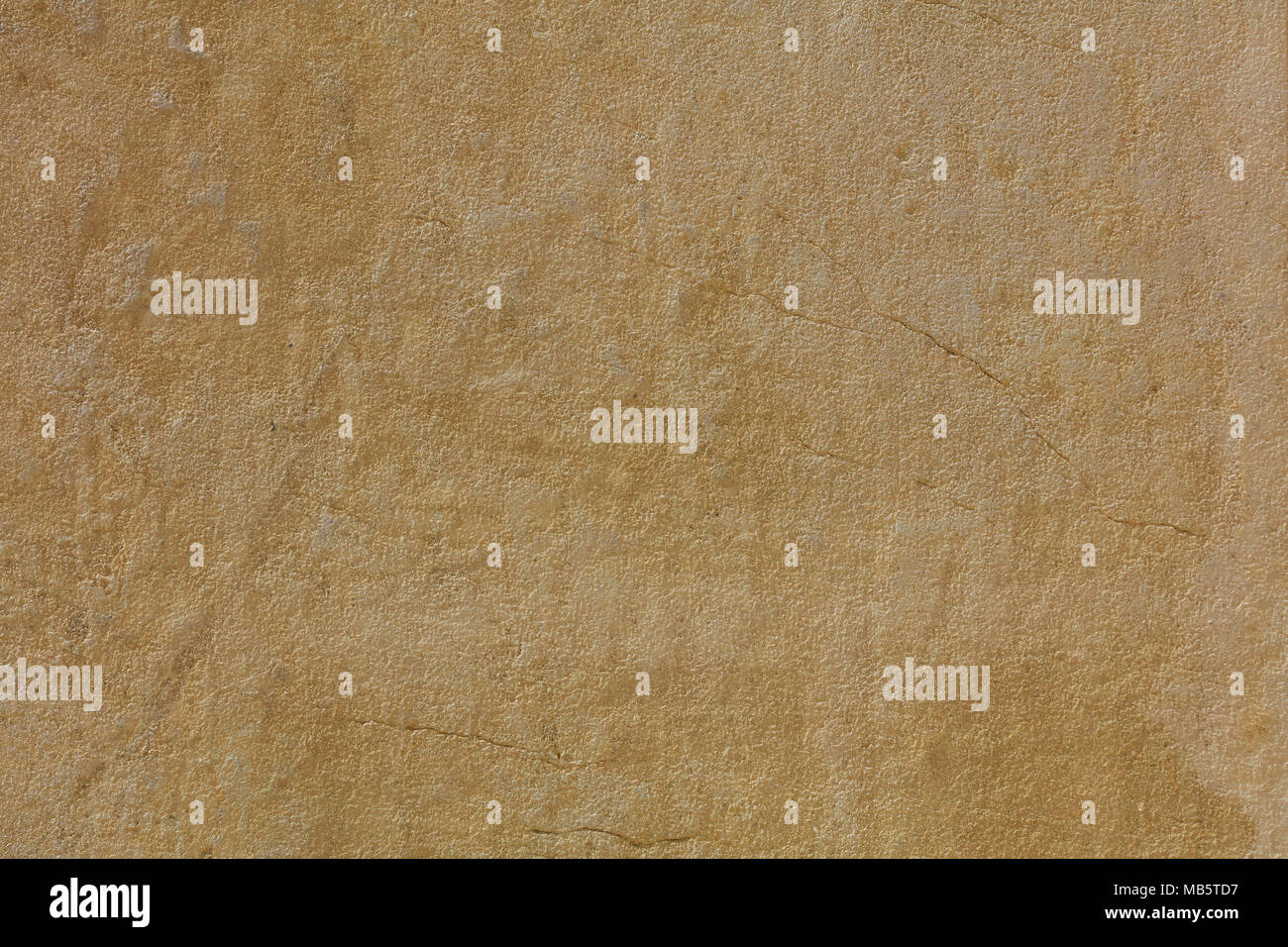 Weathered yellow plastered and painted wall background Stock Photo