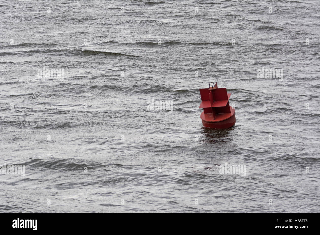 Red buoy on a river water surface with waves Stock Photo Alamy