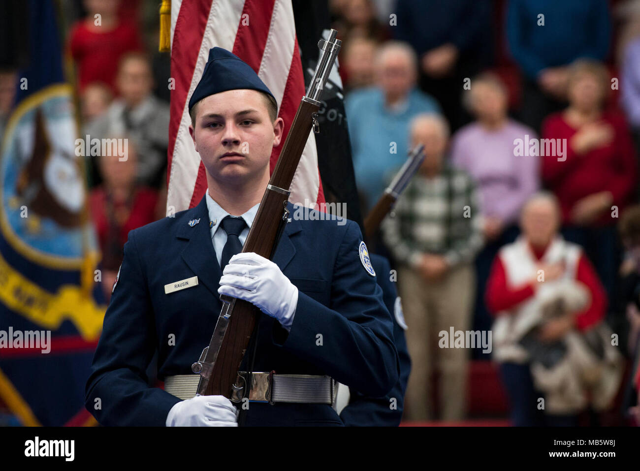 RANCHO CORDOVA, Calif. (Feb. 22, 2018) The Cordova High School Air Force Junior Reserve Officer Training Corps Color Guard, led by Cadet 2nd Lt. Jaeden Gaw, presents the colors before a U.S. Navy Band concert at Cordova High School in Rancho Cordova, California. The Navy Band performed in 12 states during its 21-city, 5,000-mile tour, connecting communities across the nation to their Navy. Stock Photo
