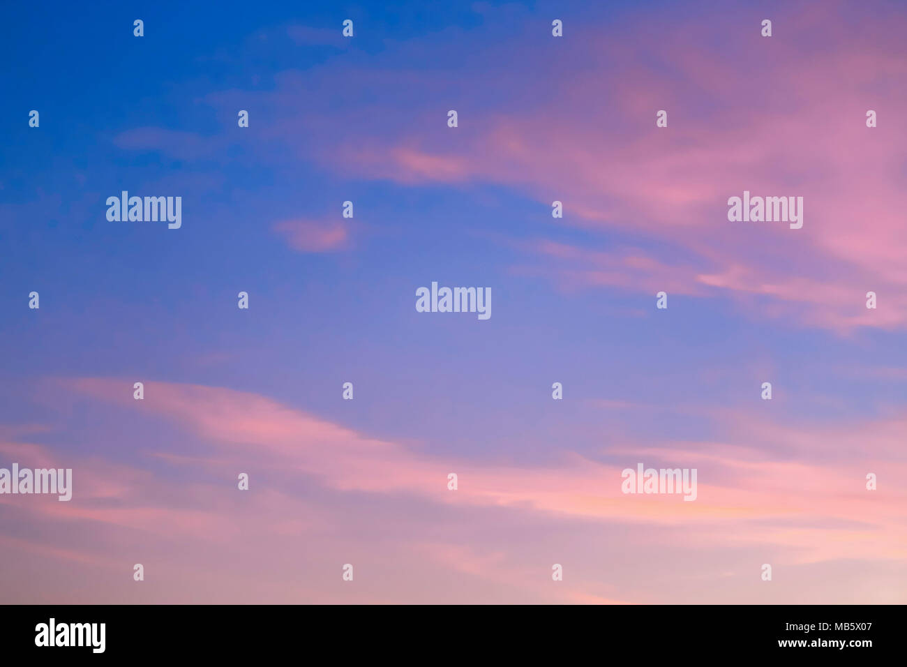 A simple somewhat cloudy sky near sunset. Stock Photo