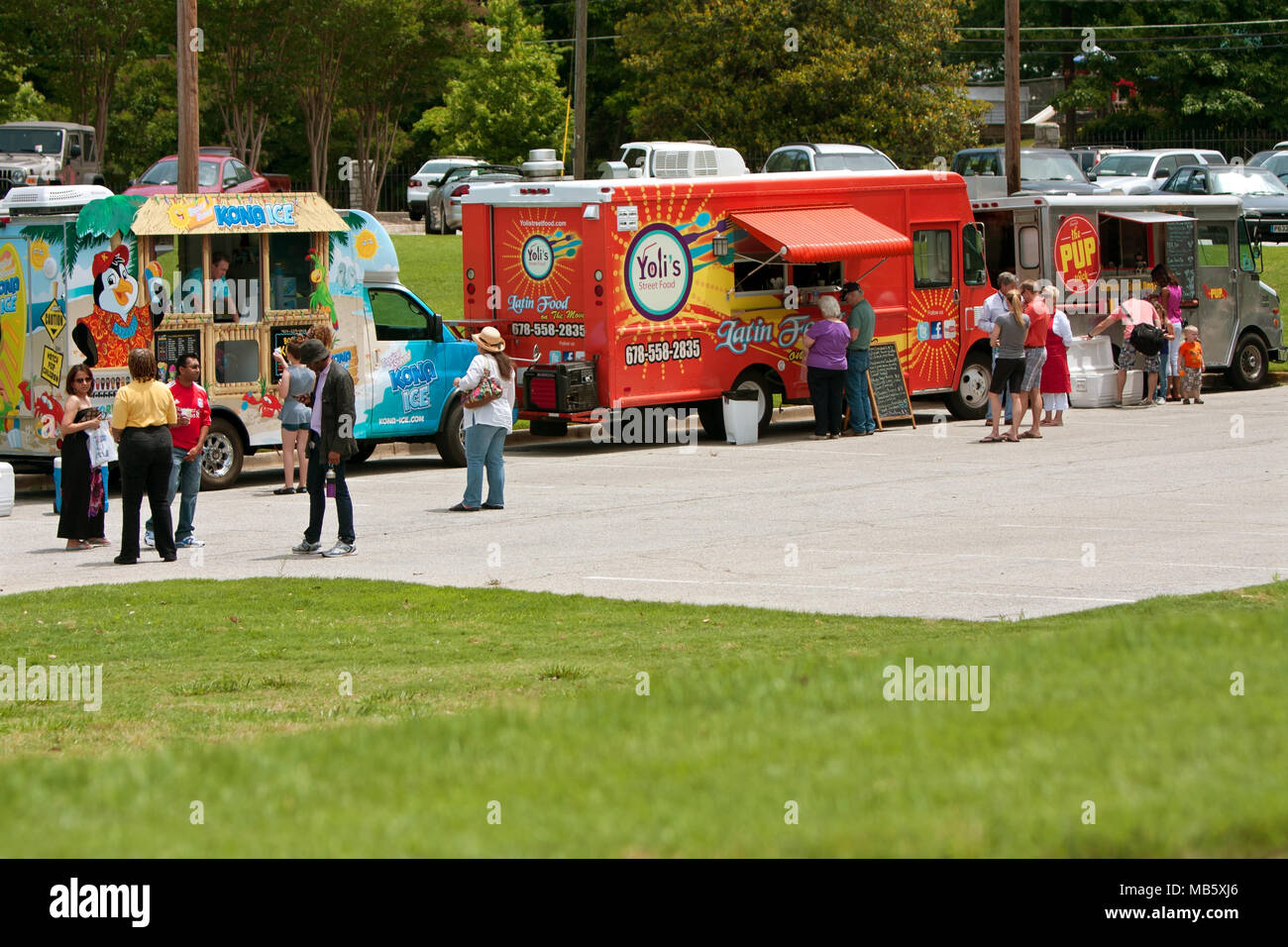 Atlanta, GA, USA - May 25, 2013:  Patrons buy food from food trucks at the GREAT festival, an event celebrating Great Britain and the United Kingdom. Stock Photo