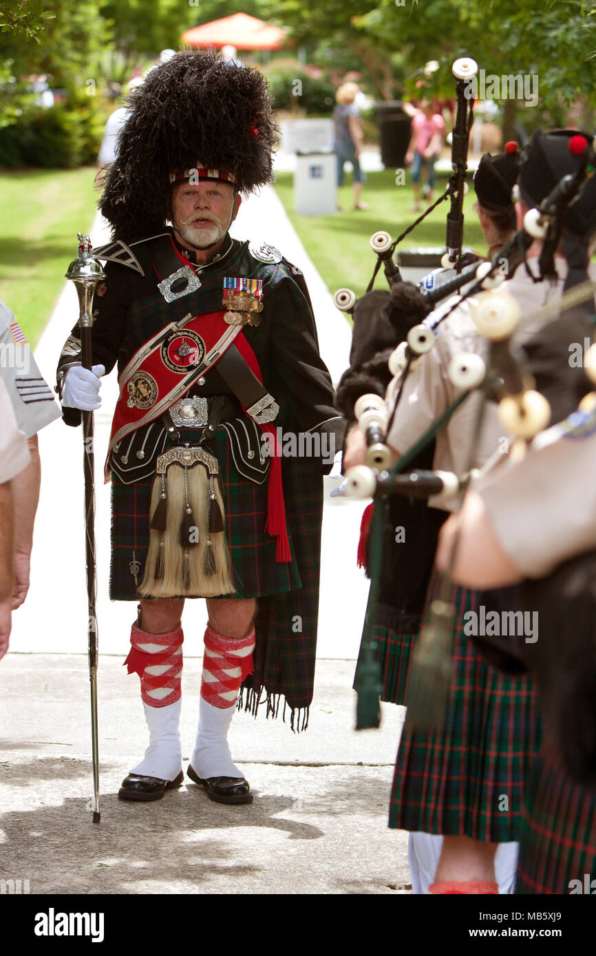 A drum major leads a local bagpipes group in performing at the GREAT festival, celebrating Great Britain and the UK, on May 25, 2013 in Atlanta, GA. Stock Photo
