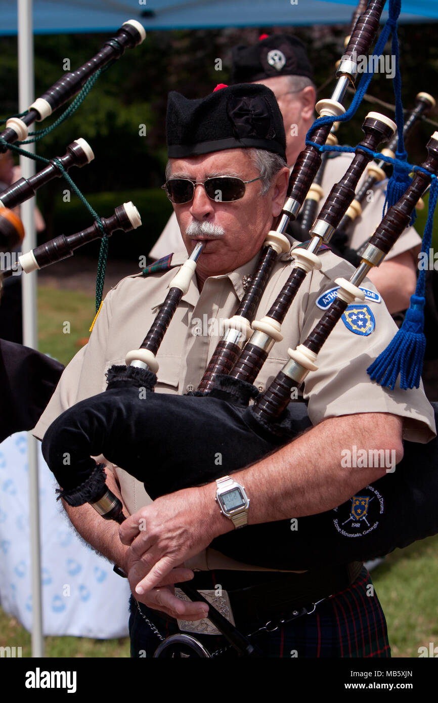 An unidentifed man plays the bagpipes to open the GREAT festival,  celebrating Great Britain and the UK, on May 25, 2013 in Atlanta, GA. Stock Photo
