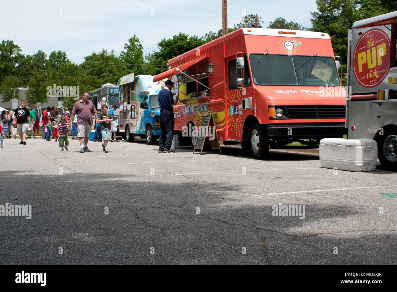 Atlanta, GA, USA - May 25, 2013: Patrons buy food from food trucks at