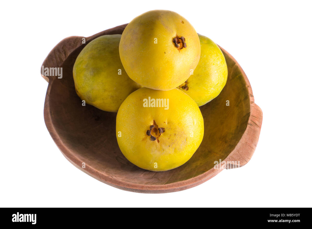 araza fruits in wooden bowl isolated on white from the Amazon area of Ecuador Stock Photo