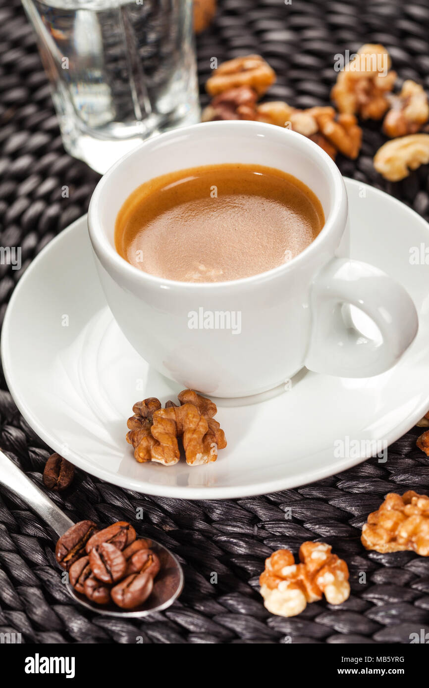 Black espresso coffee and walnuts Stock Photo Alamy