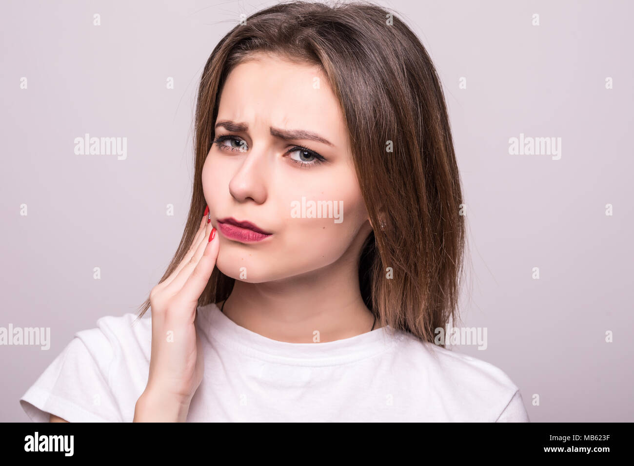 Teeth Problem. Woman Feeling Tooth Pain. Closeup Of A Beautiful Sad