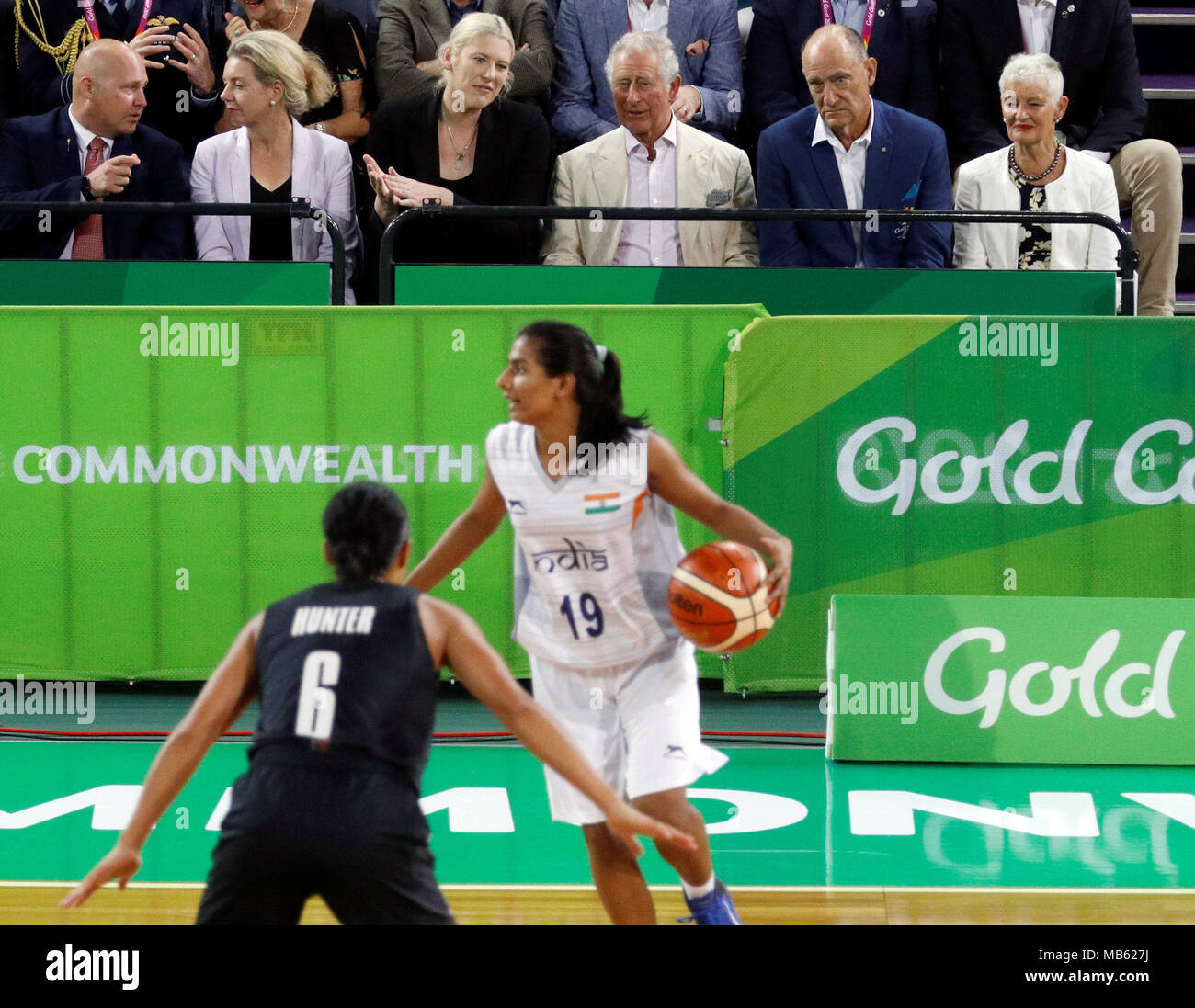 The Prince of Wales (3rd right) watches a Commonwealth Games womens basketball match between New Zealand and India at the Cairns Convention Centre, Australia. Stock Photo