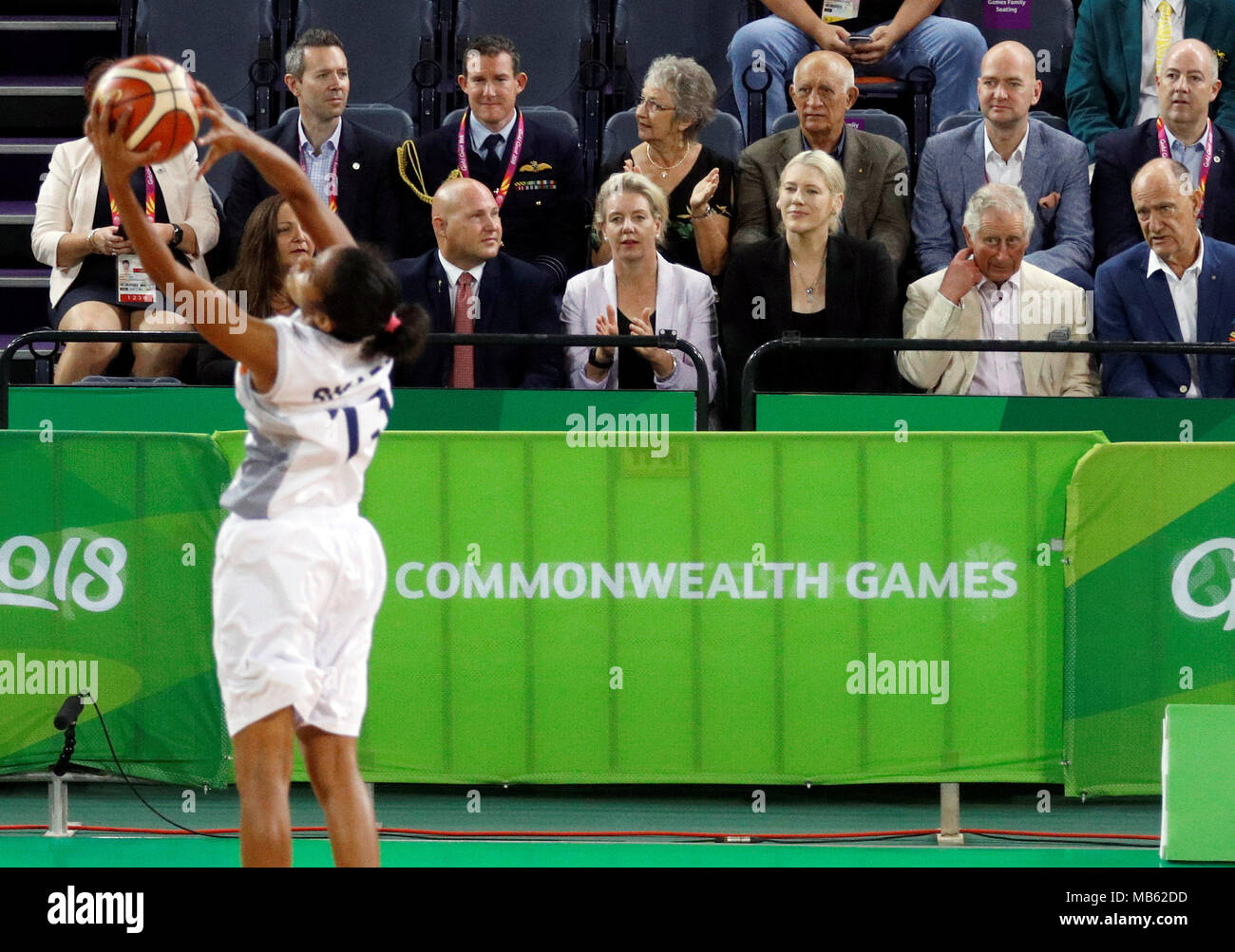 The Prince of Wales (2nd right) watches a Commonwealth Games womens basketball match between New Zealand and India at the Cairns Convention Centre, Australia. Stock Photo