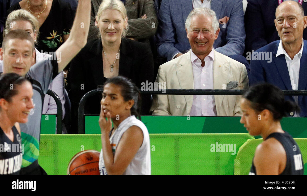 The Prince of Wales (2nd right) watches a Commonwealth Games womens basketball match between New Zealand and India at the Cairns Convention Centre, Australia. Stock Photo