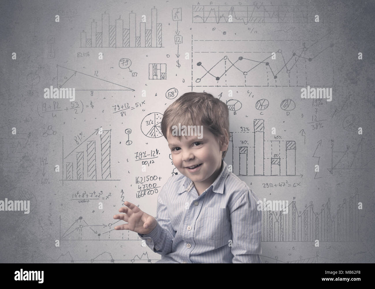 Little boy in front of a grey wall with graphs and statistics around ...