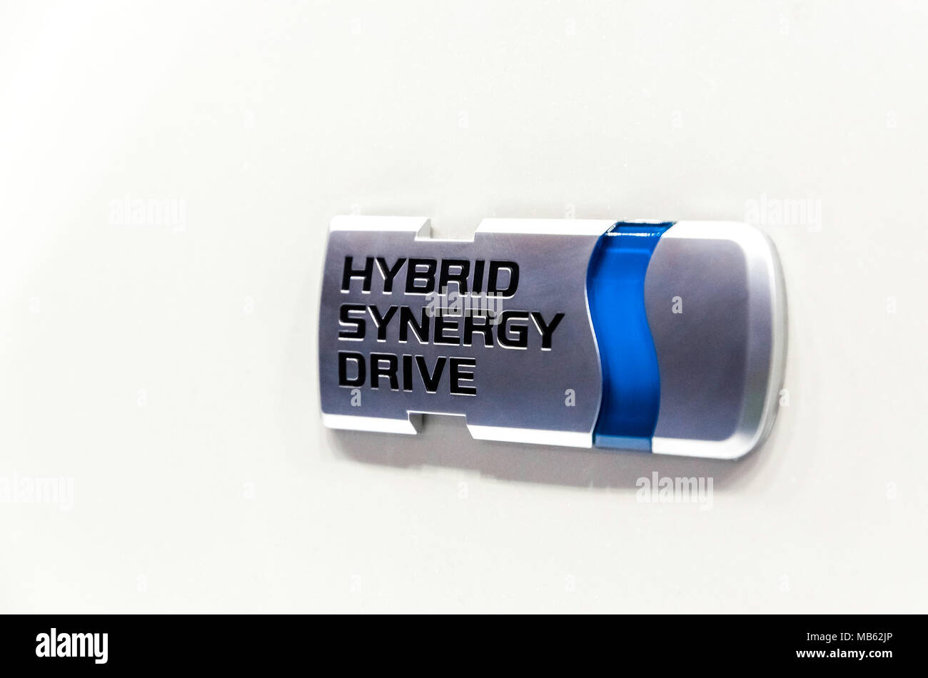 Belgrade, Serbia - 13. March, 2010: Close up of Hybrid Synergy Drive Toyota Logo on a pearl white car. Stock Photo