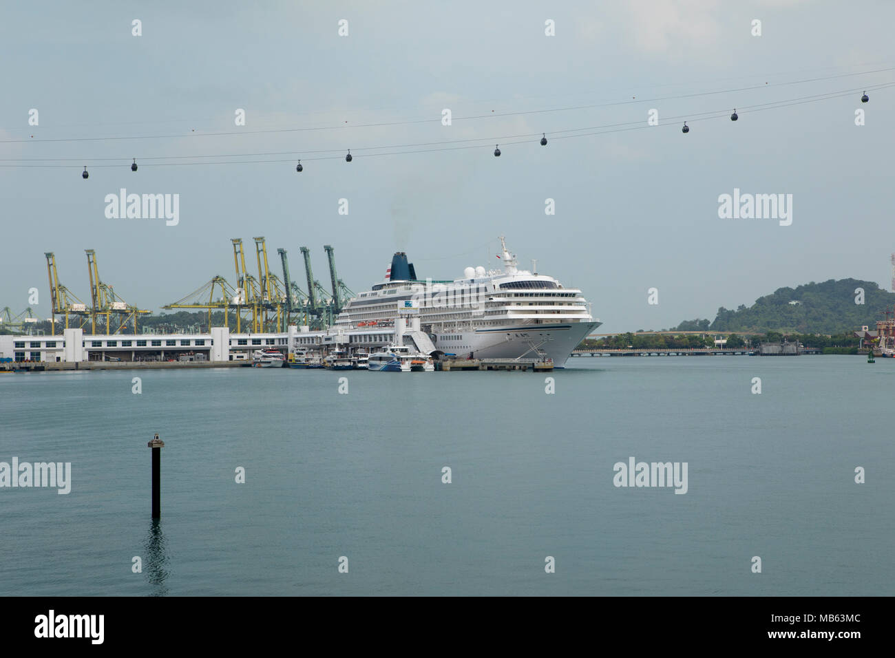 Cruise Ship Asuka Ii Owned And Operated By Nippon Yusen Kaisha Moored Near Sentosa Island In Singapore The Island Cable Car Crossing Above Stock Photo Alamy