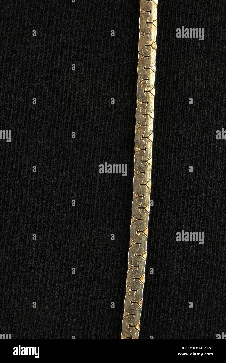 Feminine jewelry gold chain, large closeup (macro Stock Photo Alamy