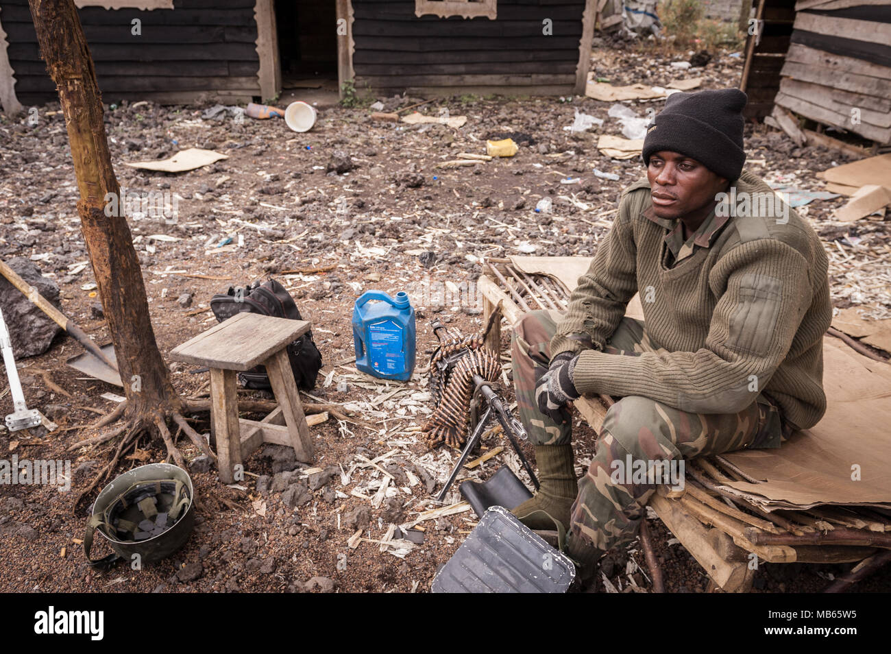 A DRC government soldier takes a break from sentry duty the conflict with the Rwandan sponsored M23 militia Stock Photo