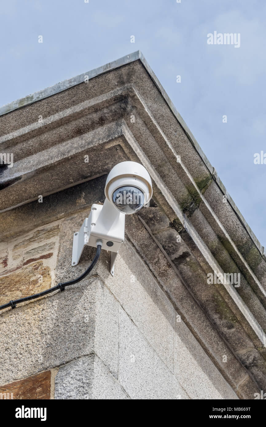 CCTV security camera on corner of building Watching over You