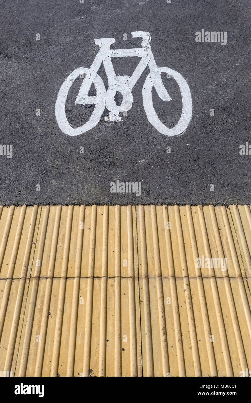 Bike lane / Cycle way marking in Bodmin, Cornwall. Cycling infrastructure UK, cycle lane UK, green transport, environmentally friendly metaphor. Stock Photo