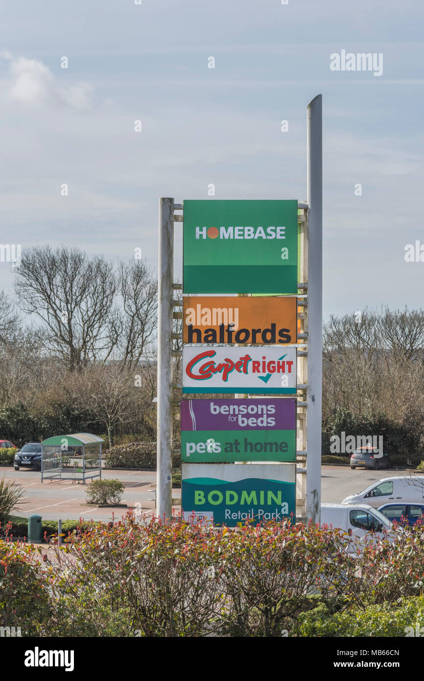 Corporate logos (including failing Carpetright & Homebase) at Bodmin Retail Park, Cornwall. Sign of high street recession and shop / store failures. Stock Photo