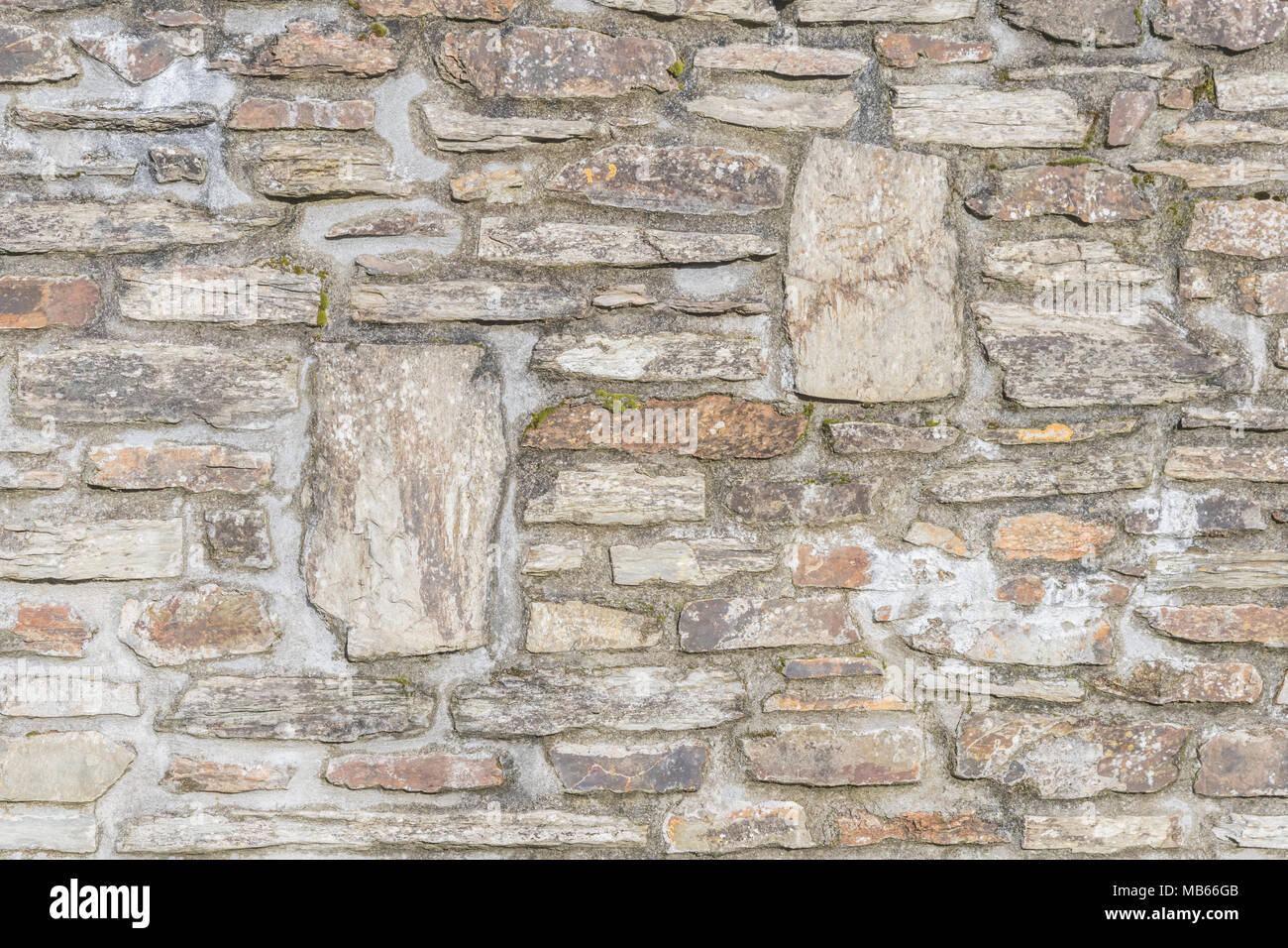 Random irregular stonework of a wall in Cornwall, UK Stock Photo