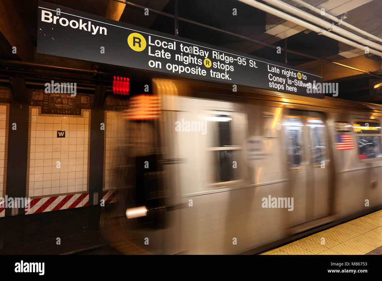 An R Subway train arrives at Brooklyn station at New York City, USA