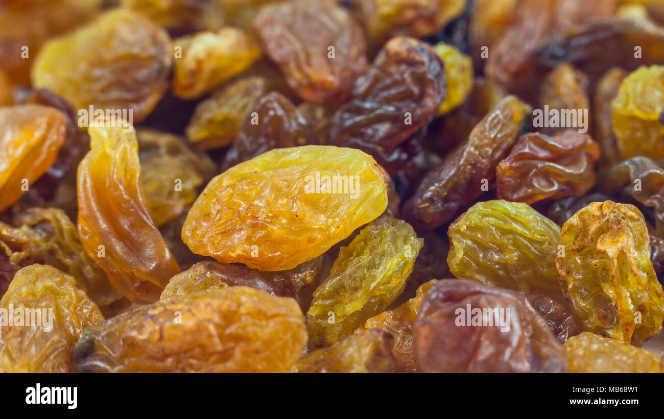 Dried grape raisins background, close up Stock Photo Alamy