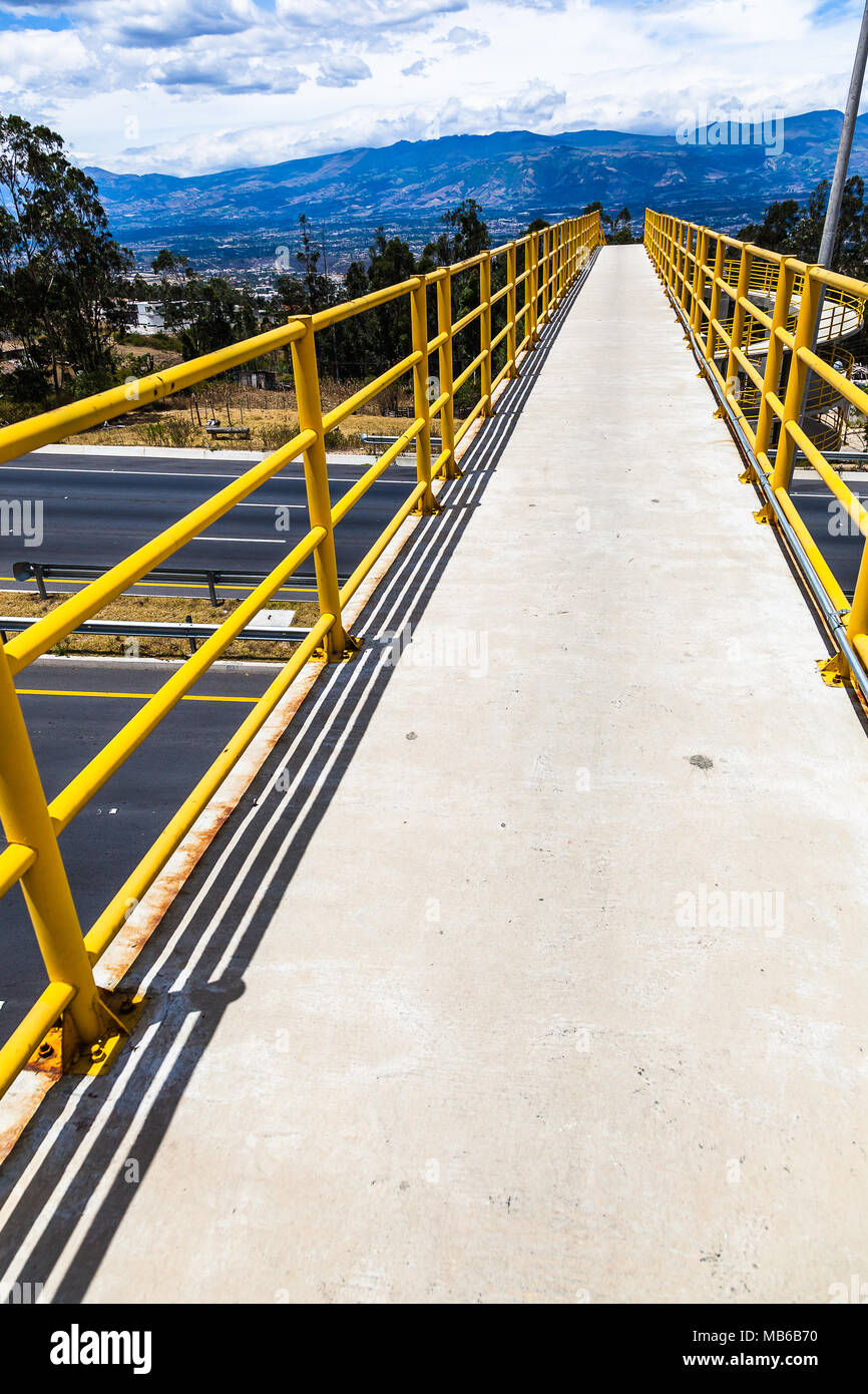 Elevated pedestrian overpass, with handrails painted in yellow Stock ...