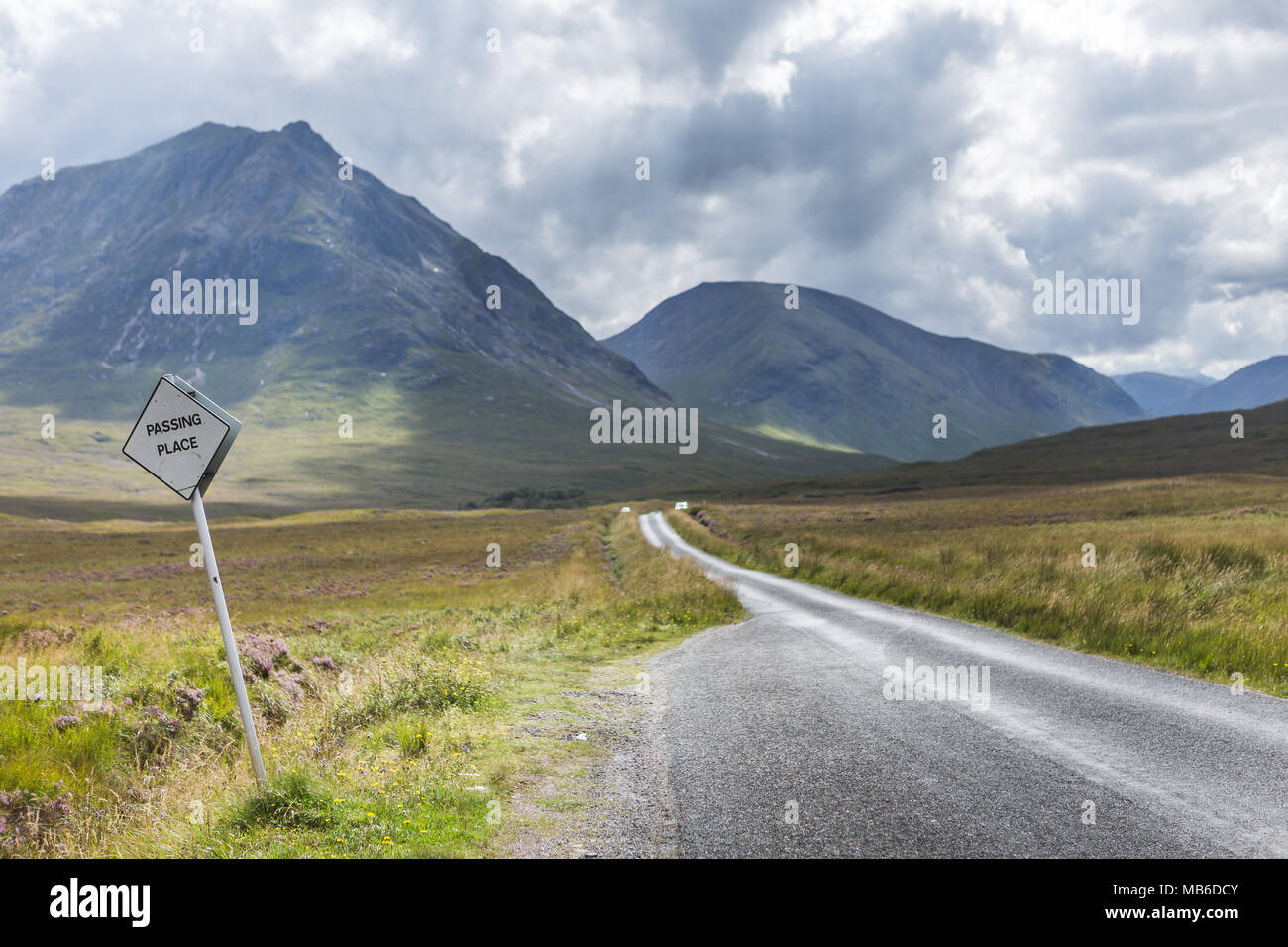 passing place sign beside empty road, glencoe, scotland Stock Photo