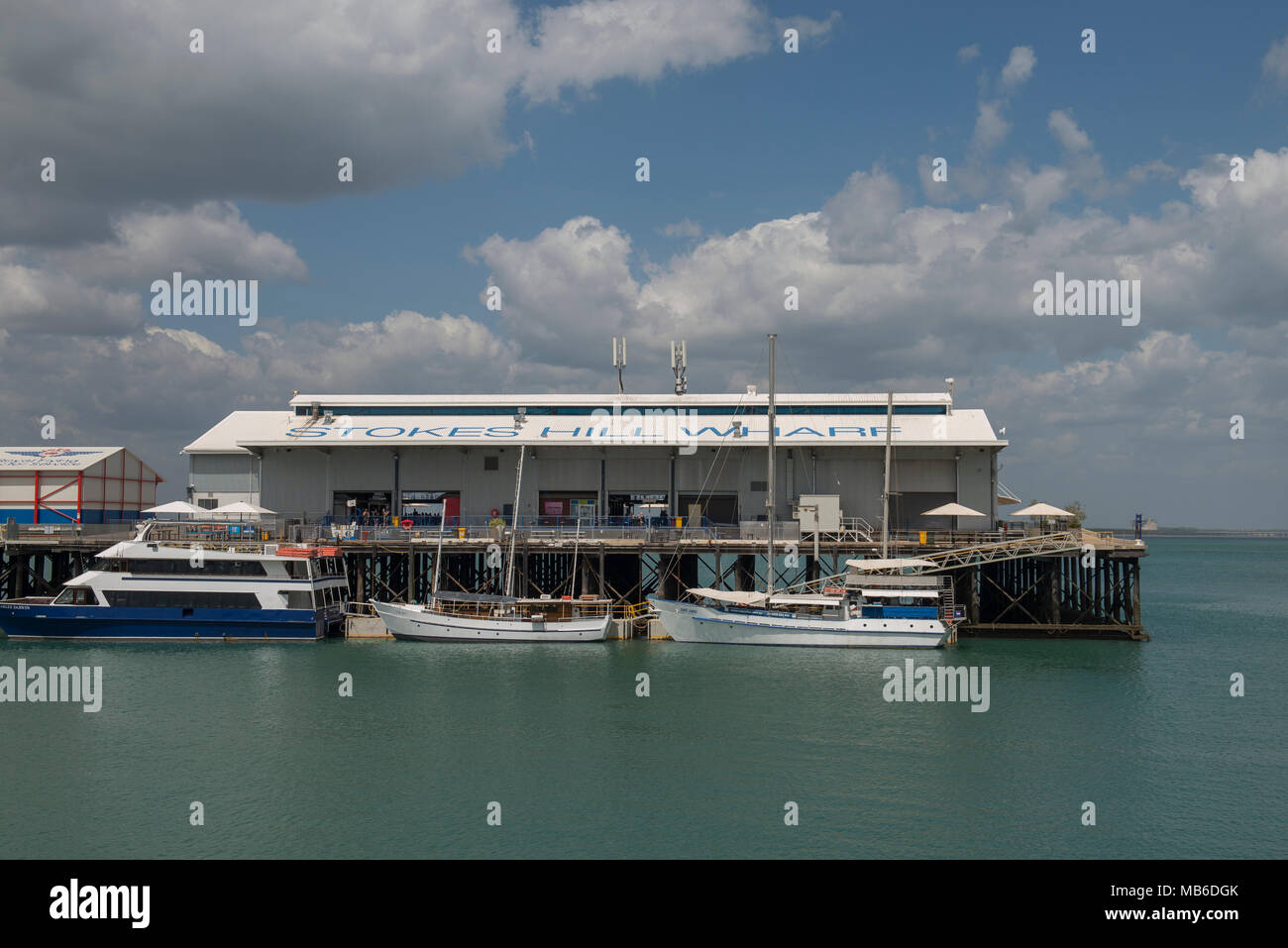 The historic Stokes Hill Wharf is a popular tourist location. It is still a working wharf for smaller marine industry users, yachts and harbour tours. Stock Photo