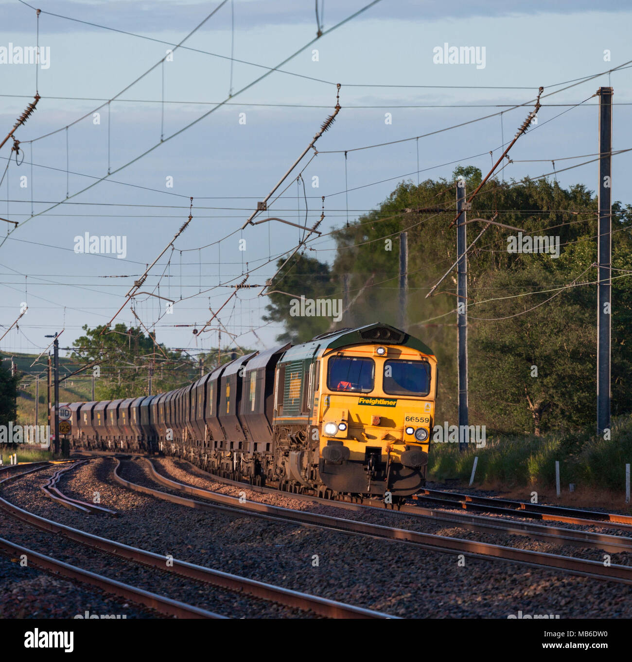 A Freightliner Class 66 Diesel Locomotive Hauling An Empty Merry Go Round Coal Freight Train On 