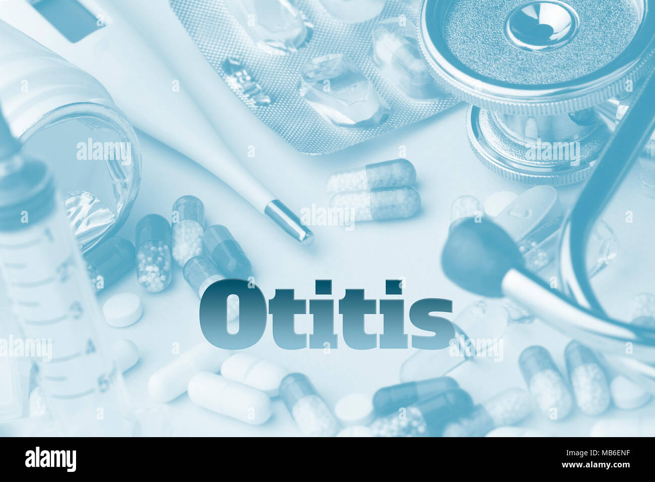 Otitis - diagnosis written on blue background. Set of medical devices and pills. Toning. Stock Photo