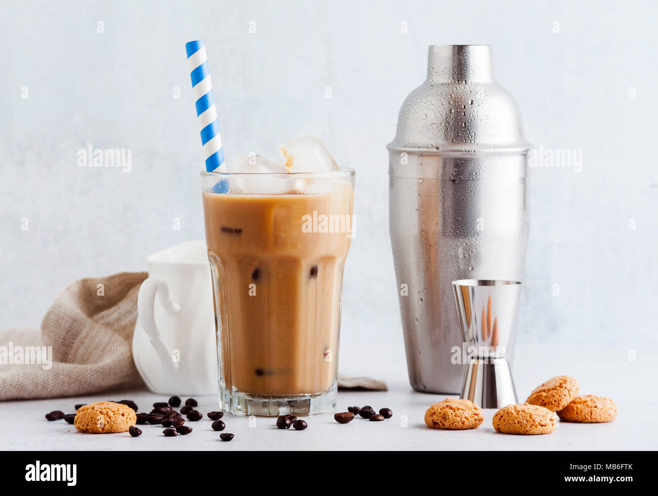 Coffee frappe in a tall glass with ice . and Amaretti cookies Stock ...