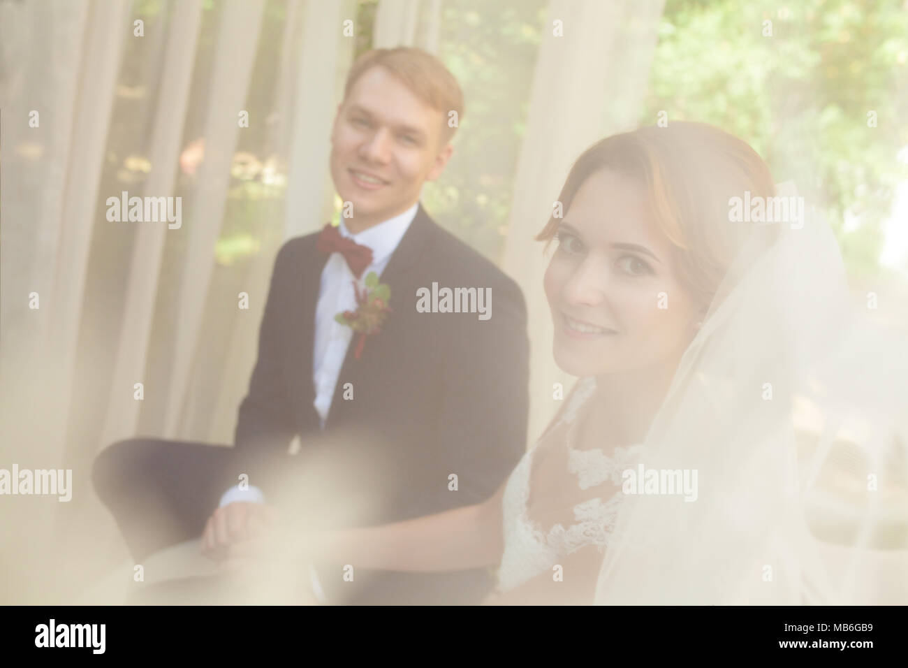 Happy newlyweds holding hands hi-res stock photography and images - Alamy