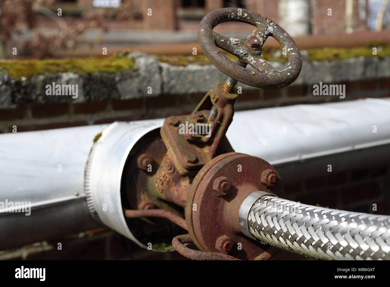 Water shut off valve at abandoned factory site in Zwevegem, Belgium. Stock Photo