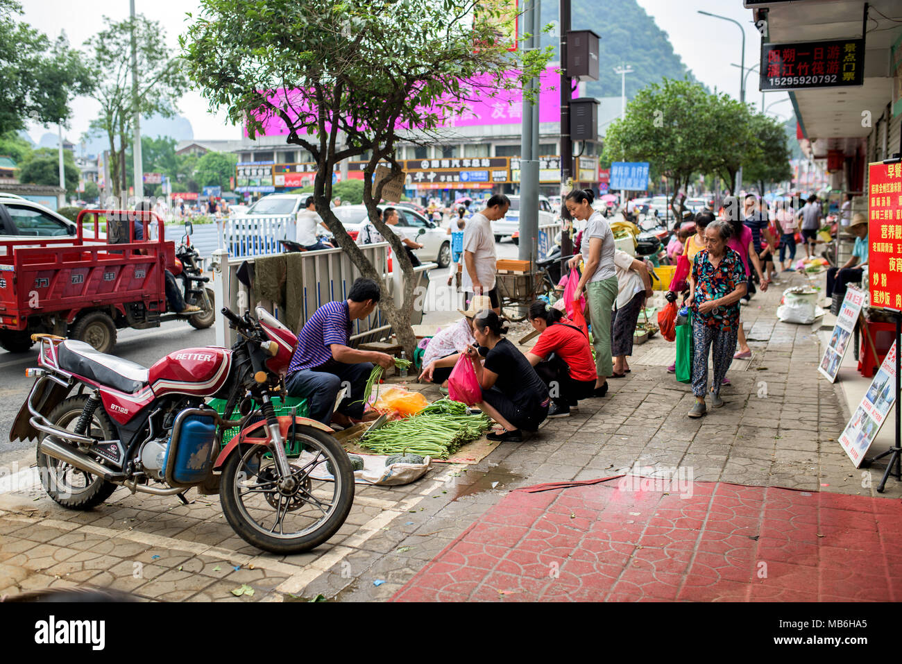 People on the streets of Guilin city, China Stock Photo