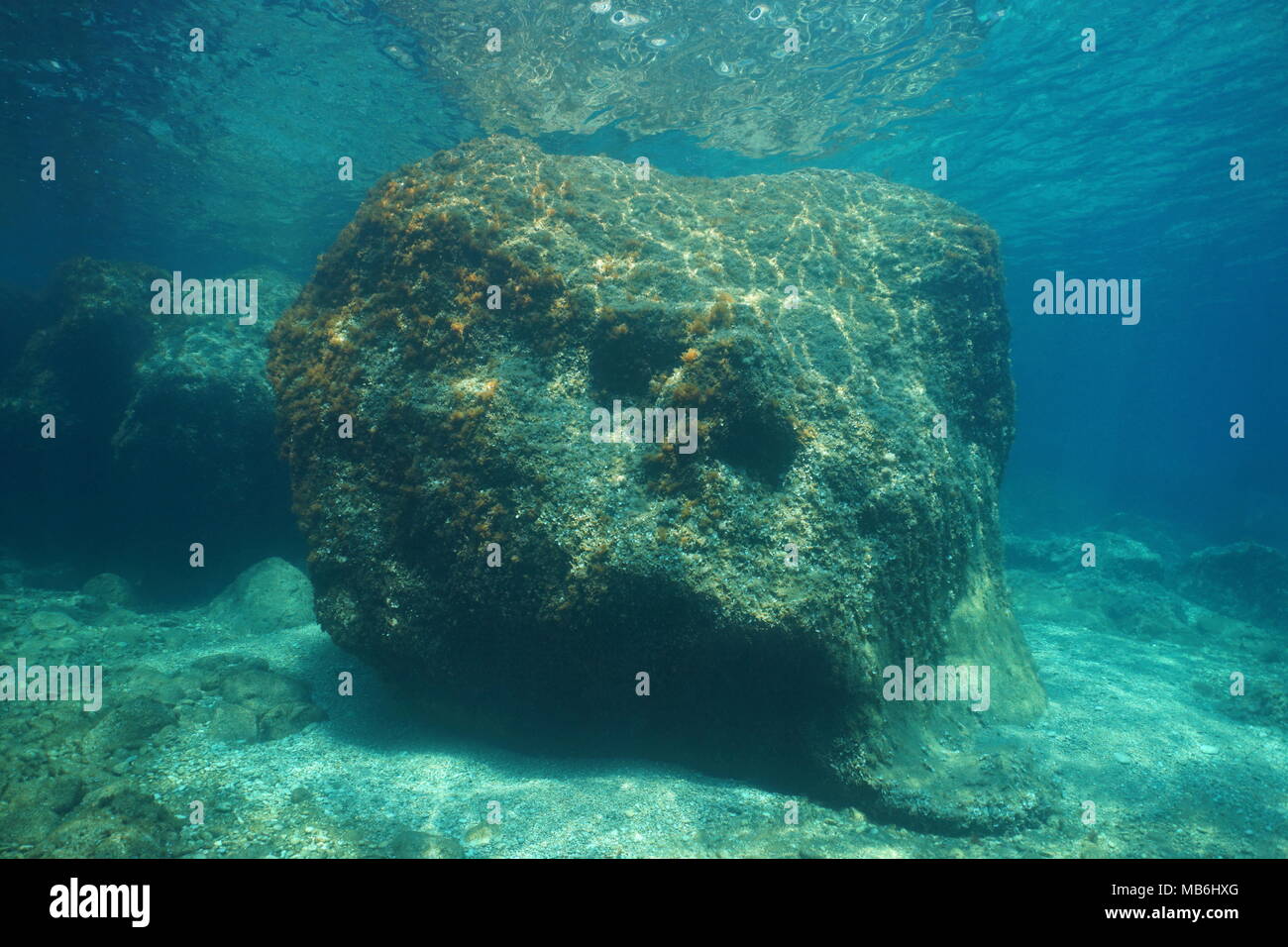 A large rock underwater below water surface in the Mediterranean sea, Costa Brava, Cap de Creus, Catalonia, Spain Stock Photo