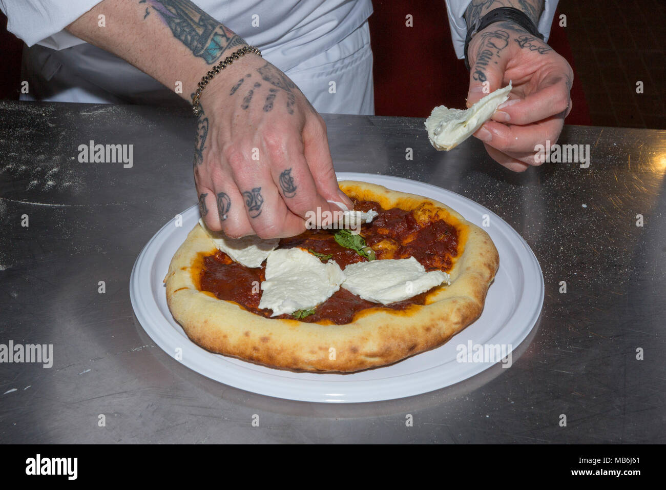 Pizza chef Gennaro Nasti demonstrates the art of making a pizza