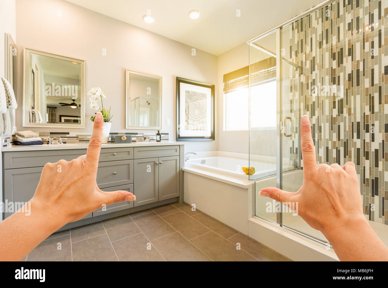Hands Framing Custom Master Bathroom Interior. Stock Photo