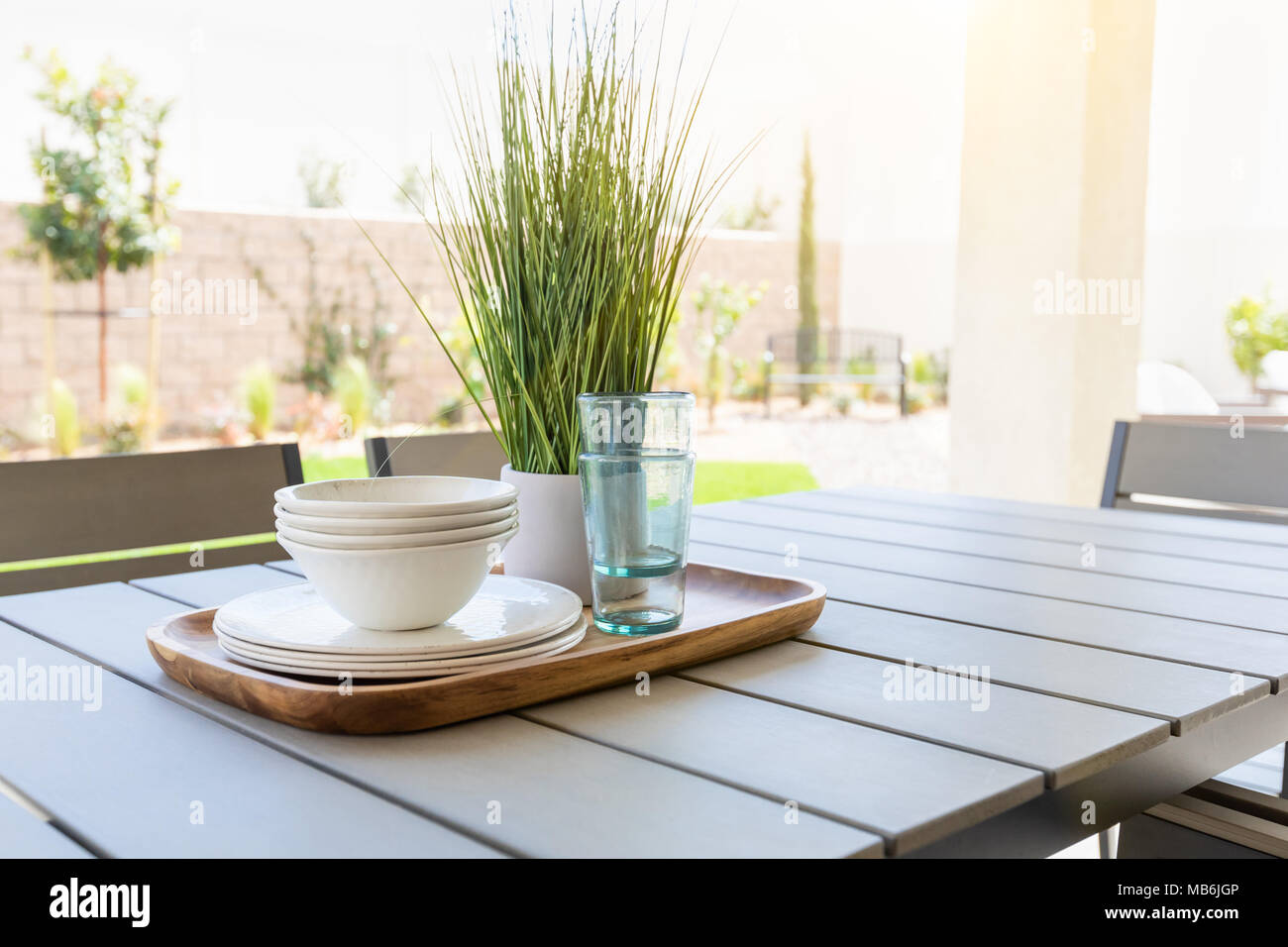 Outdoor Patio Setting with Dishes and Glasses on Tray Stock Photo Alamy