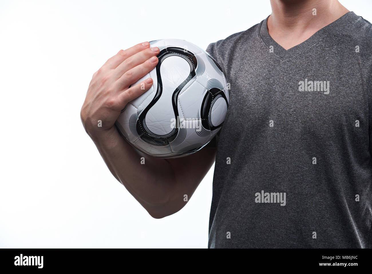 Football player with ball in generic gray uniform close-up isolated Stock Photo