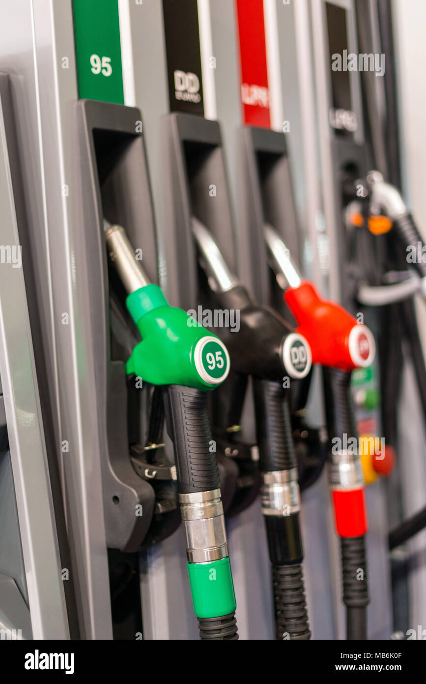 Selective focus photography. Colorful Petrol pump filling nozzles , Gas