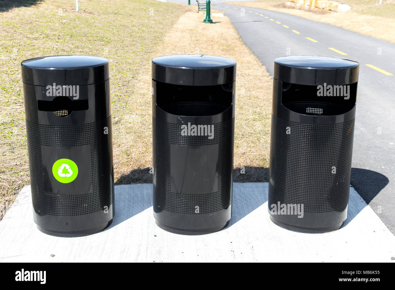Three black recycle and garbage bins in Canada Stock Photo Alamy
