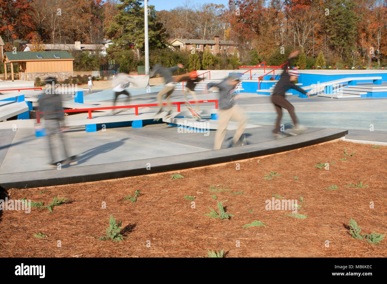 A composite of several motion blurs shows skateboarders taking part in the grand opening of the skateboard park in Kennesaw, GA on November 24, 2013. Stock Photo