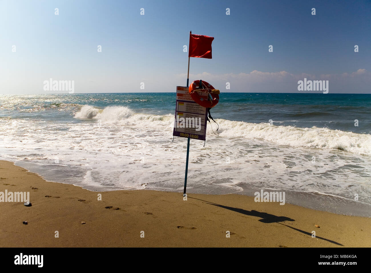 Red flag on the beach, meaning that swimming is dangerous. Turkey Stock