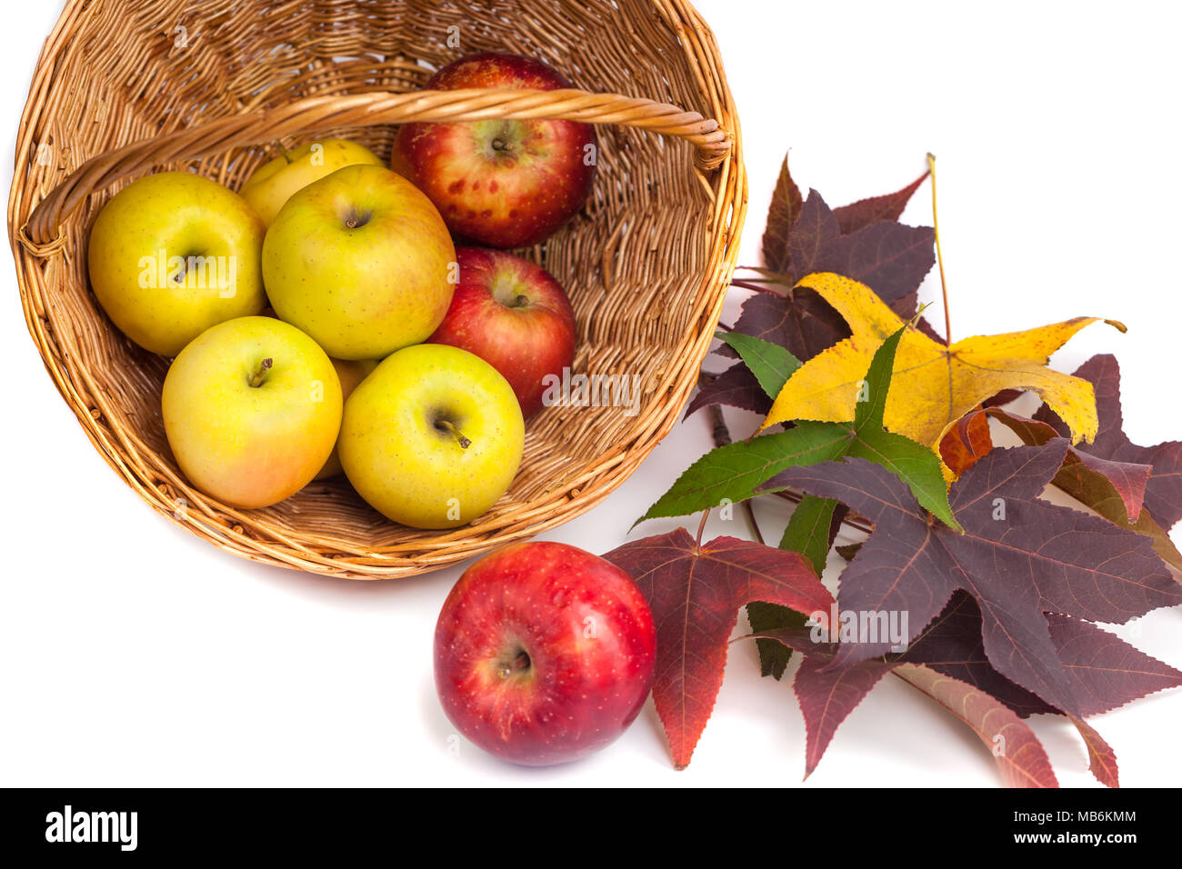 apples in a wicker basket on a white background Stock Photo - Alamy