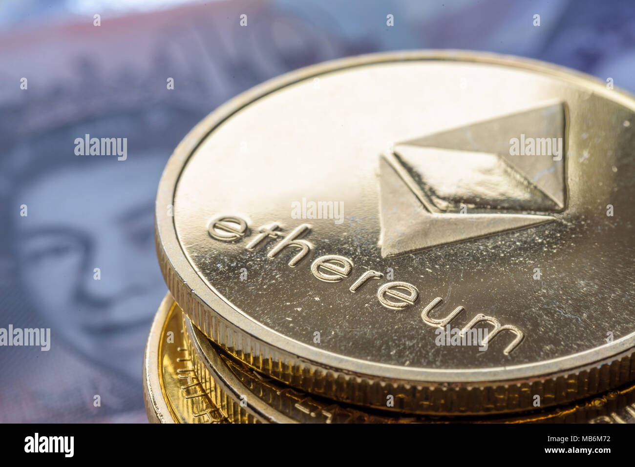Ethereum coins stacked on new British Pound Sterling note, future concept  financial currency, crypto currency sign Stock Photo - Alamy