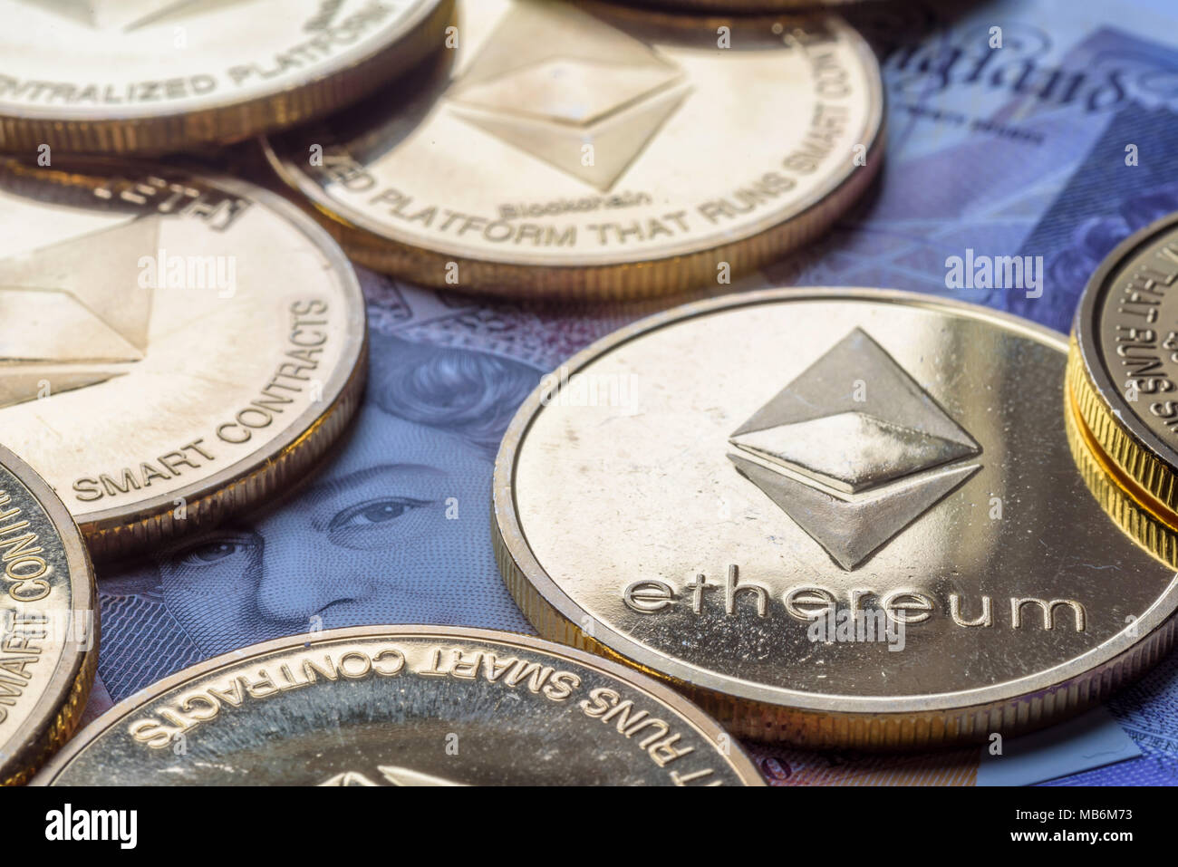 Ethereum coins stacked on new British Pound Sterling note, future concept  financial currency, crypto currency sign Stock Photo - Alamy