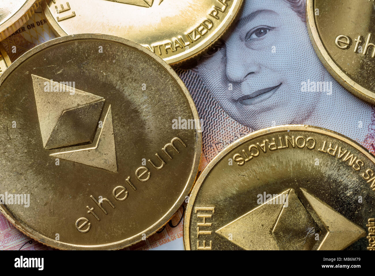 Ethereum coins stacked on new British Pound Sterling note, future concept  financial currency, crypto currency sign Stock Photo - Alamy