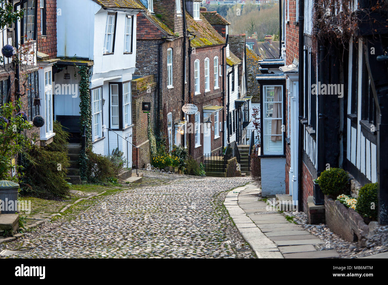 RYE, UK - APRIL 5th, 2018: Mermaid Street in  Rye is an old cobbled street which used to be the ancient town's main road. This famous street is lined  Stock Photo