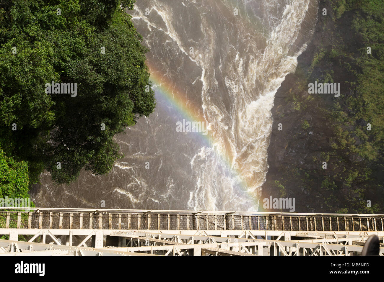 Rainbow seen from Victoria Falls Bridge on the border of Zimbabwe and Zambia. The bridge spans the River Zambezi. Stock Photo